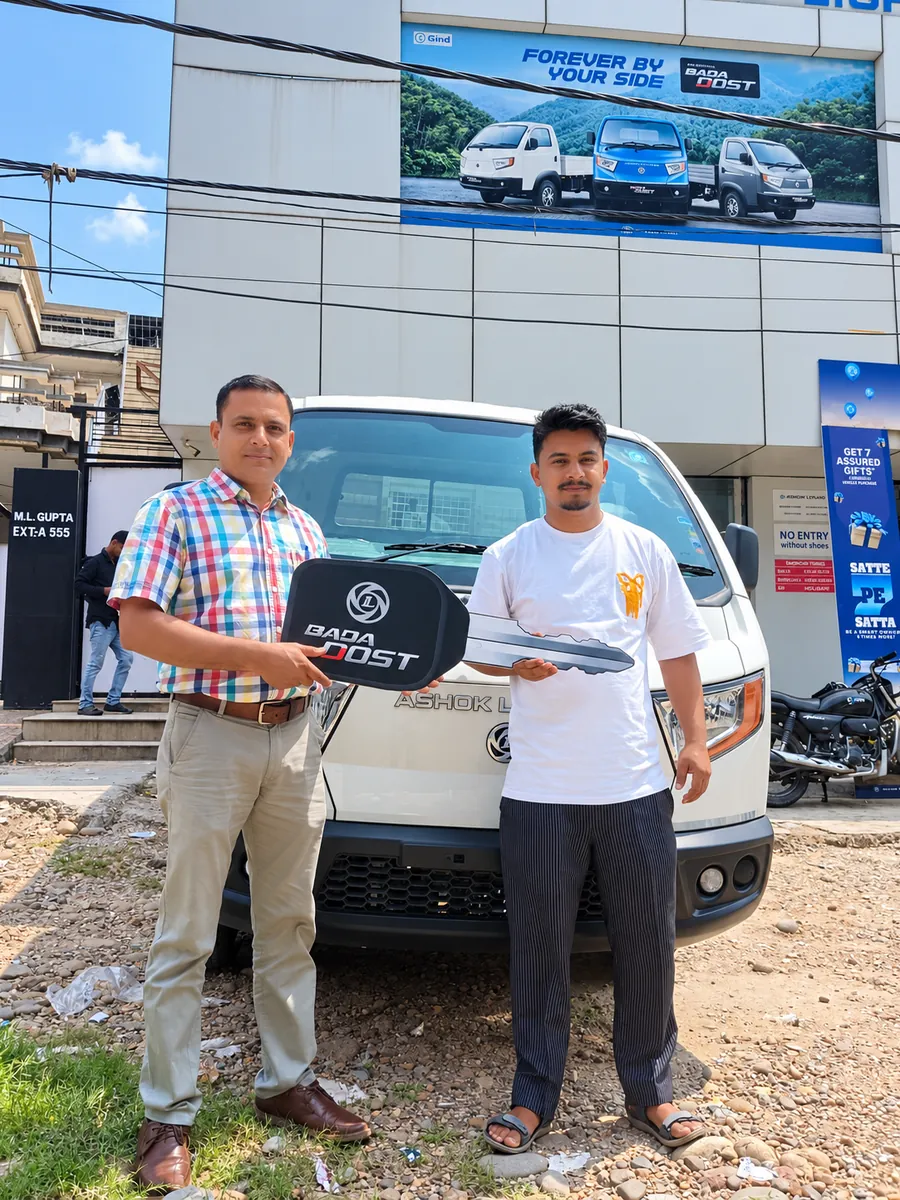 Customer with a newly delivered Ashok Leyland BADA DOST outside the YA Mobility showroom