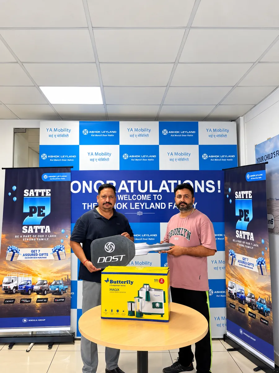 Customer receiving keys and gifts on delivery day at YA Mobility